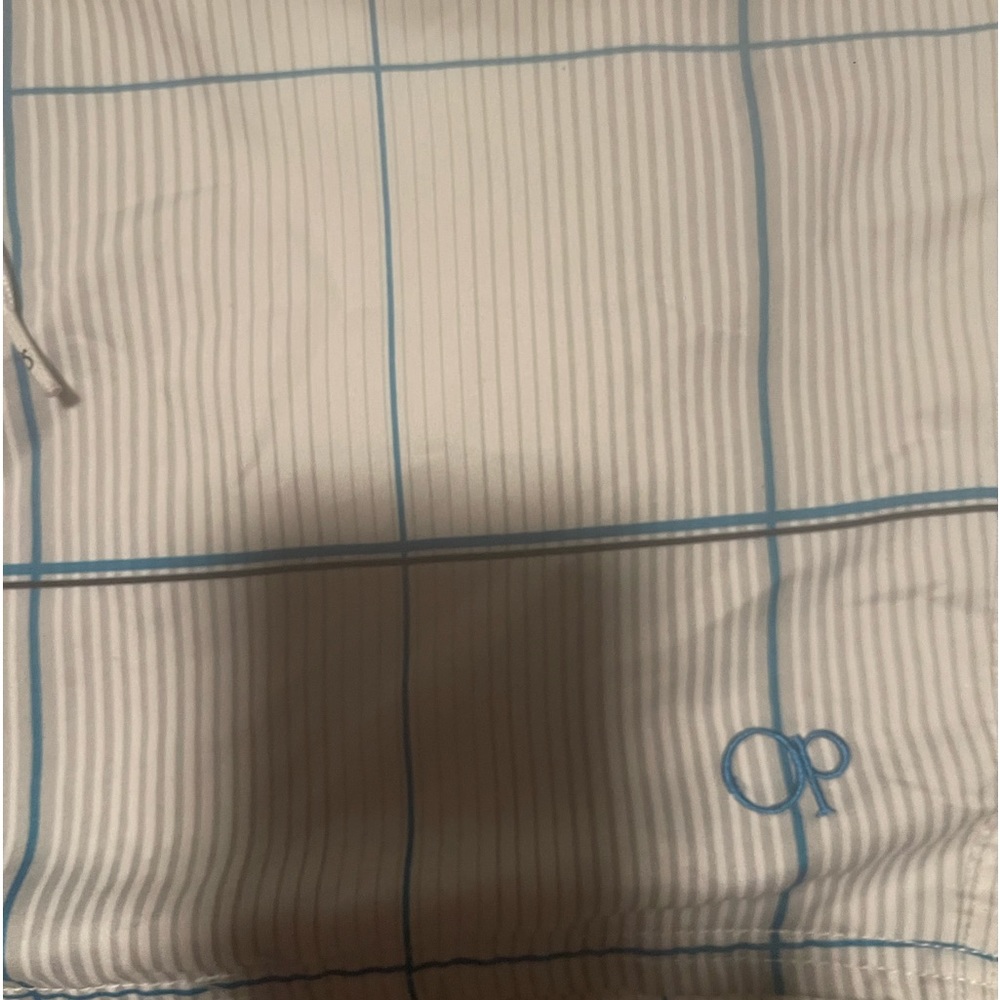 Blue and white strip swim shorts has tie and Velcro and pockets